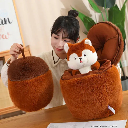Person holding a plush squirrel-shaped bag with a small white animal plush toy inside, on a wooden surface.